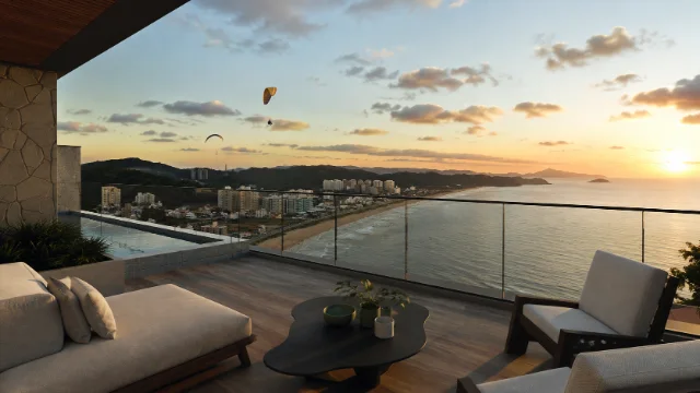 Varanda do Zaya Brava com vista para a Praia Brava ao entardecer